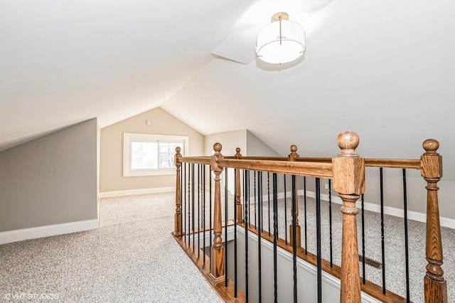 bonus room with carpet floors and vaulted ceiling