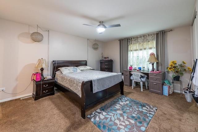 bedroom with ceiling fan and dark colored carpet