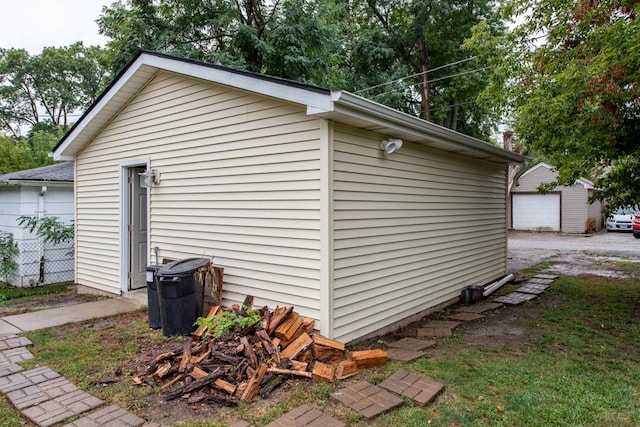 view of side of home with an outdoor structure