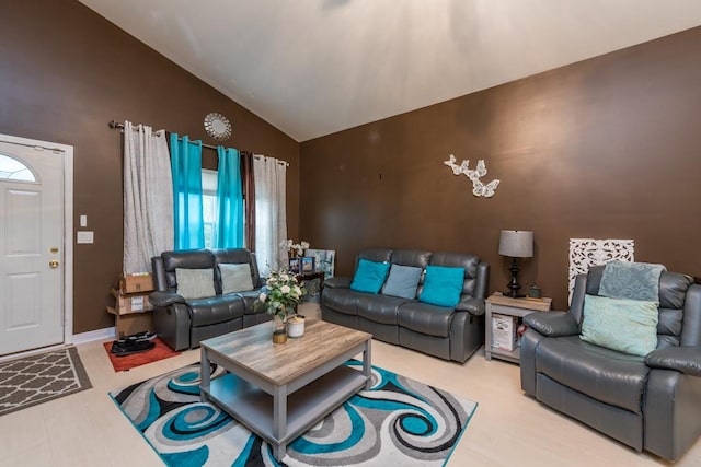 living room featuring lofted ceiling