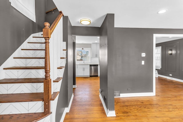 stairs with wood-type flooring