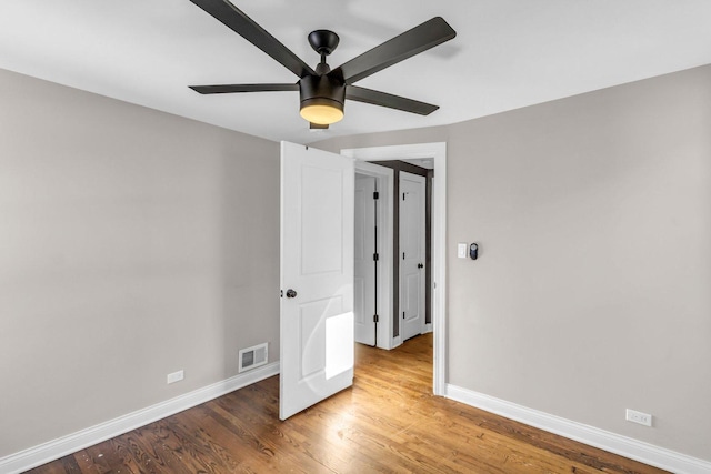 unfurnished bedroom featuring ceiling fan and hardwood / wood-style floors