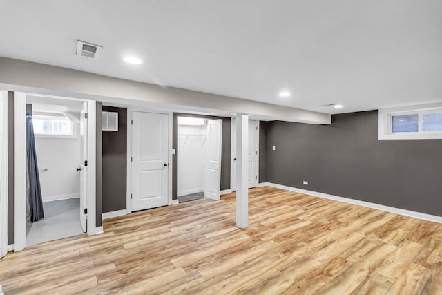 basement featuring light hardwood / wood-style floors