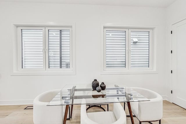 office space featuring light wood-style flooring and baseboards