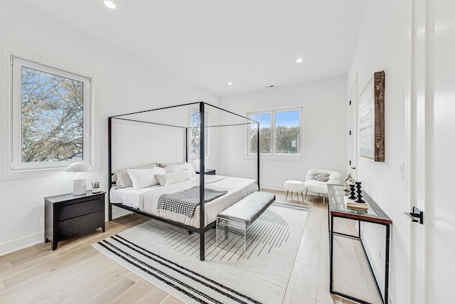 bedroom featuring light wood-type flooring, baseboards, and recessed lighting