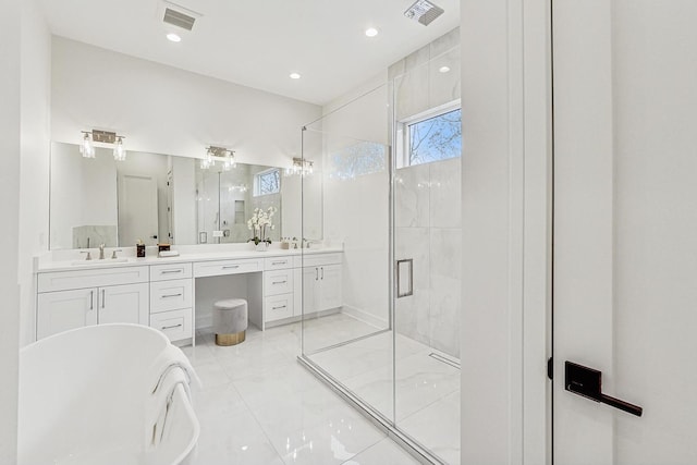 bathroom with visible vents, a sink, a shower stall, and double vanity