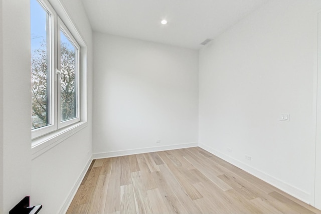 spare room with recessed lighting, baseboards, visible vents, and light wood finished floors