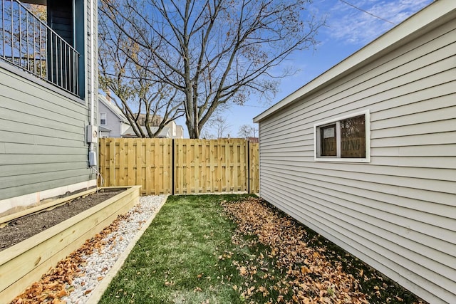 view of yard with a garden and fence