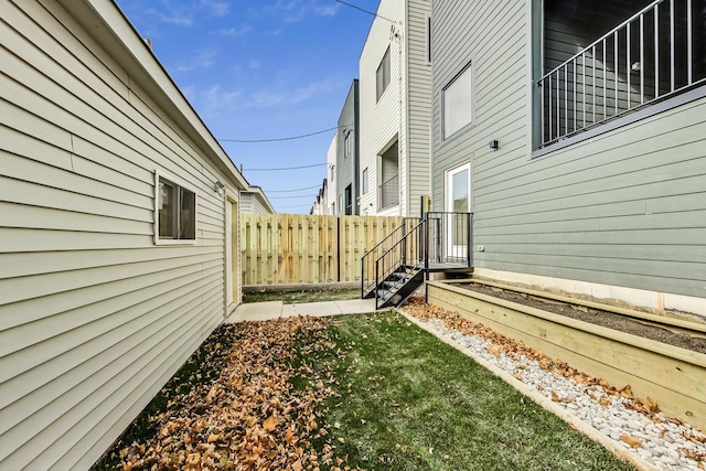 view of yard with fence and a garden