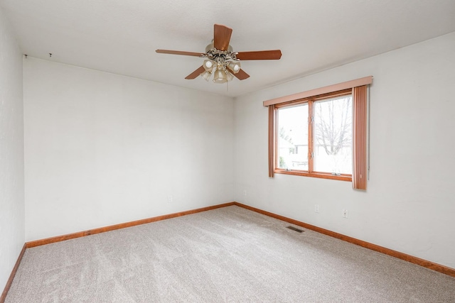 unfurnished room with carpet flooring and ceiling fan