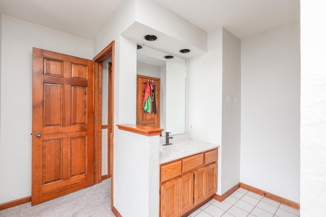 bathroom featuring tile patterned flooring and vanity