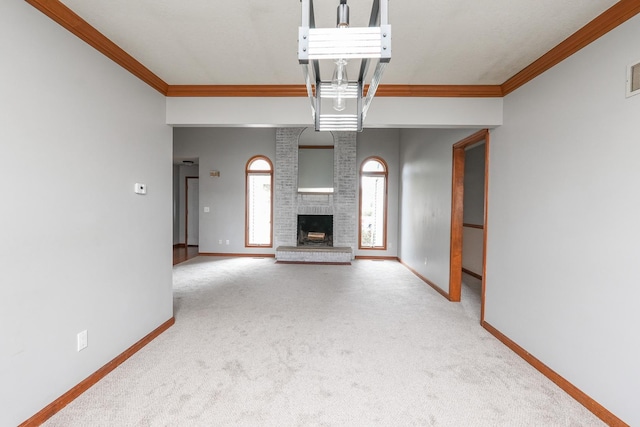 unfurnished living room featuring carpet, ornamental molding, and a brick fireplace