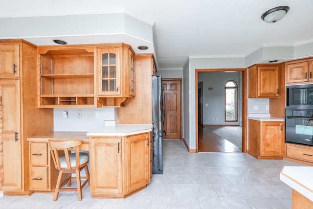 kitchen featuring built in microwave, refrigerator, and ornamental molding