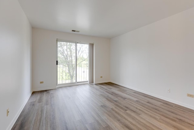 unfurnished room featuring light hardwood / wood-style flooring