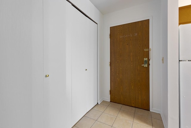 doorway featuring light tile patterned floors