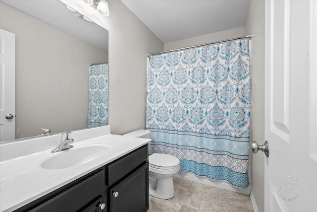 bathroom featuring toilet and vanity