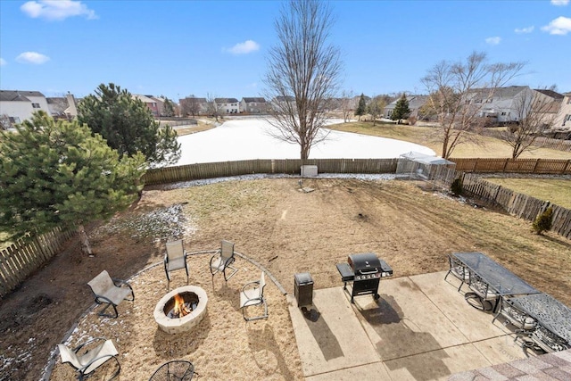 view of yard featuring an outdoor fire pit, a patio, and central AC