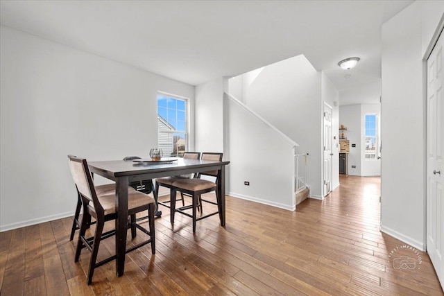 dining area featuring hardwood / wood-style floors