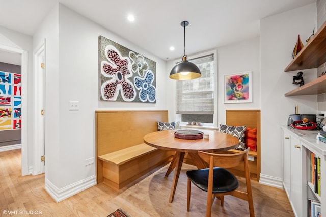 dining area with light hardwood / wood-style floors