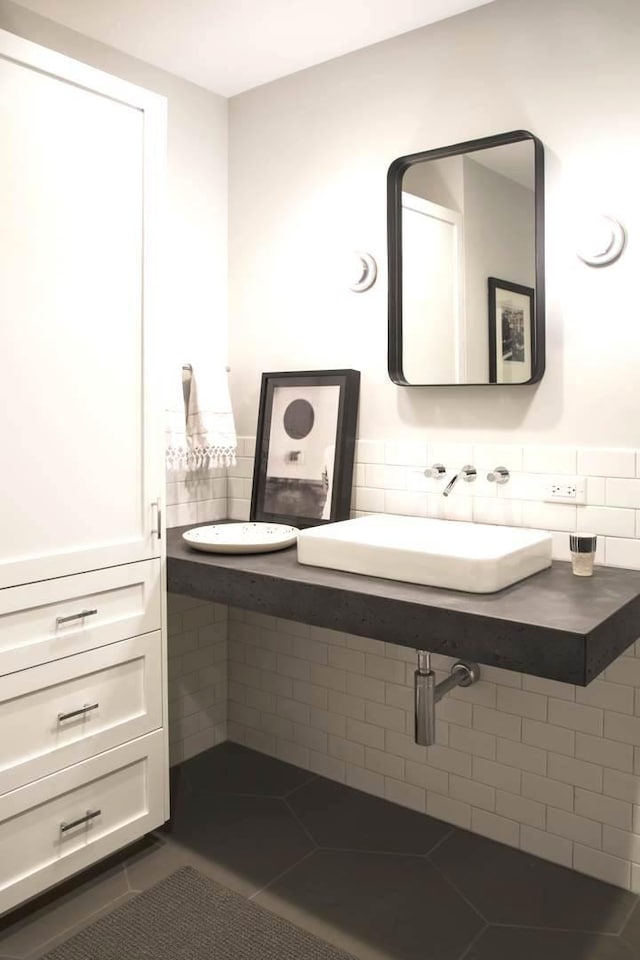 bathroom with sink and tile patterned flooring