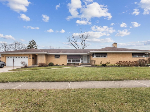 ranch-style house featuring a front yard and a garage