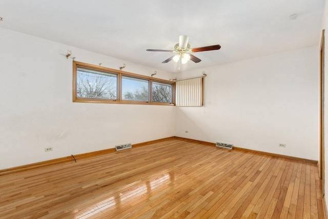 spare room featuring ceiling fan and light wood-type flooring