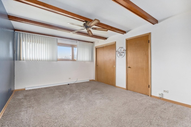 empty room with carpet, beam ceiling, ceiling fan, and a baseboard heating unit