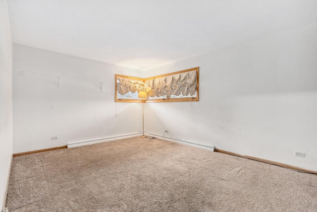 carpeted empty room with baseboard heating