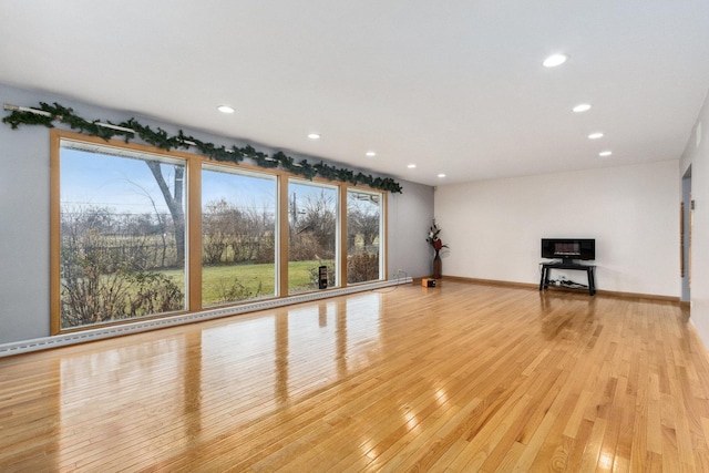 unfurnished living room featuring light hardwood / wood-style floors