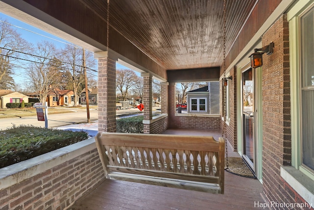 wooden deck featuring covered porch