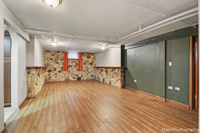 basement featuring hardwood / wood-style floors