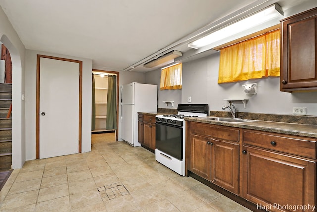 kitchen with sink and white appliances