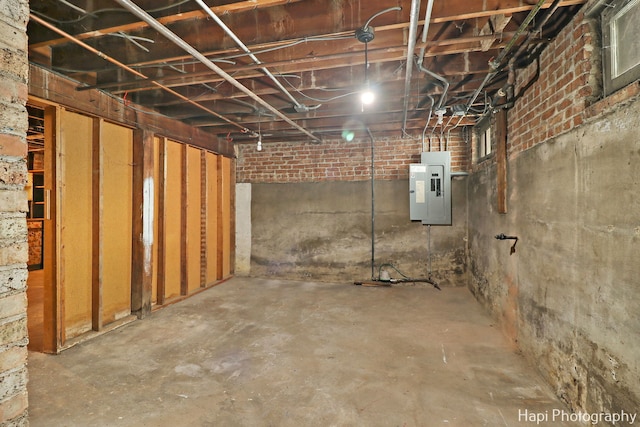 basement featuring electric panel