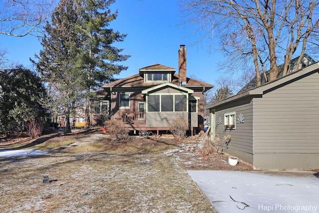 back of property featuring a sunroom