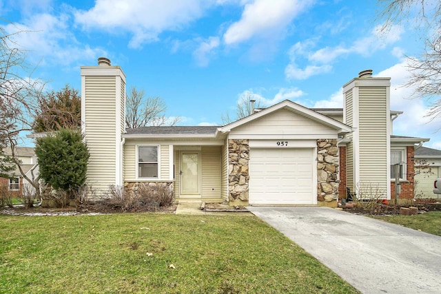 view of front of house with a garage and a front yard