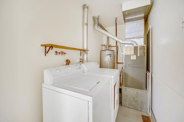 laundry room featuring independent washer and dryer and water heater