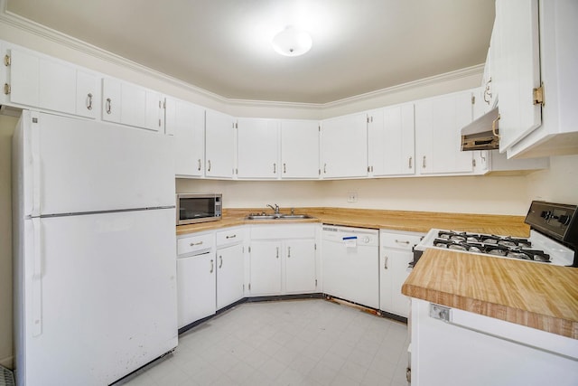 kitchen featuring white appliances, white cabinetry, ornamental molding, and sink