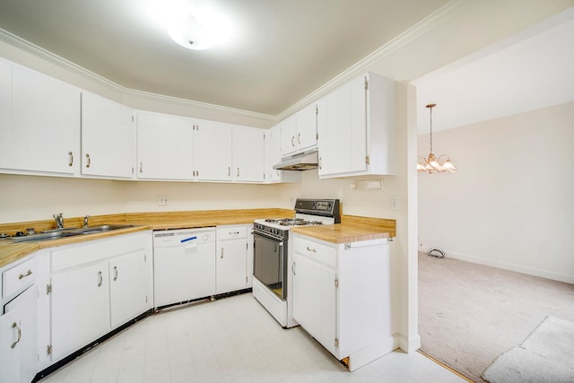 kitchen featuring sink, a chandelier, pendant lighting, white appliances, and white cabinets