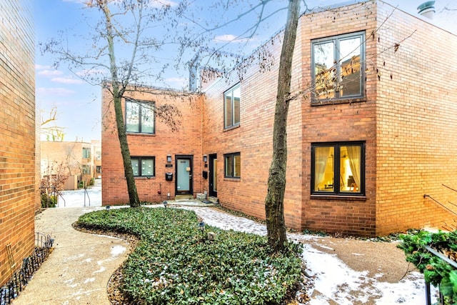 view of front facade featuring brick siding