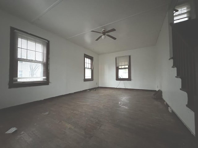 spare room featuring ceiling fan and a healthy amount of sunlight