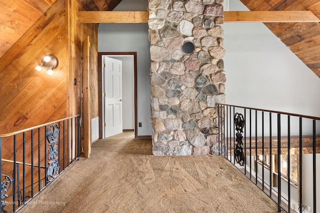 hallway with beamed ceiling, carpet floors, high vaulted ceiling, and wooden ceiling