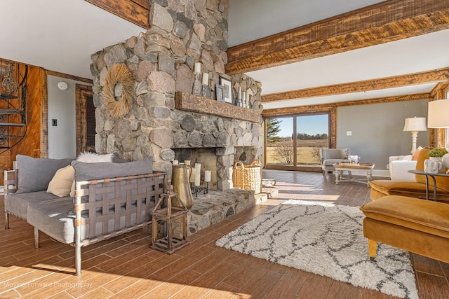 living room with beam ceiling, a fireplace, and hardwood / wood-style floors