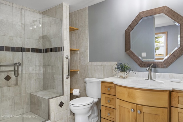 bathroom featuring vanity, toilet, tile walls, and a shower with shower door