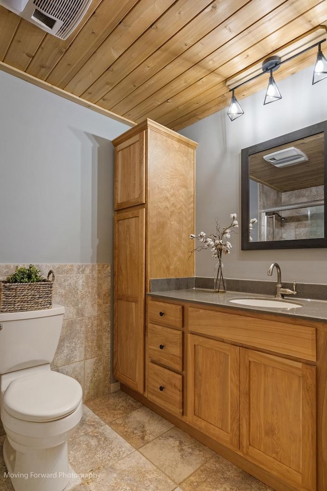 bathroom featuring vanity, toilet, and wood ceiling