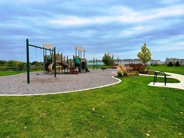 view of jungle gym with a lawn