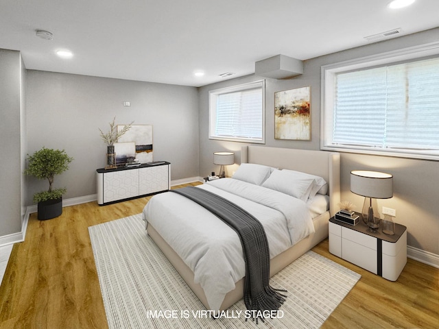 bedroom with light wood-type flooring