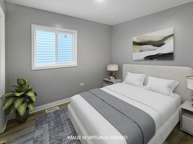 bedroom featuring dark wood-type flooring