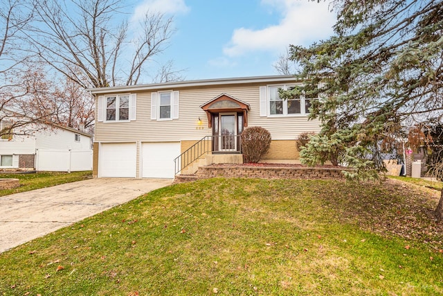 bi-level home with a garage and a front yard