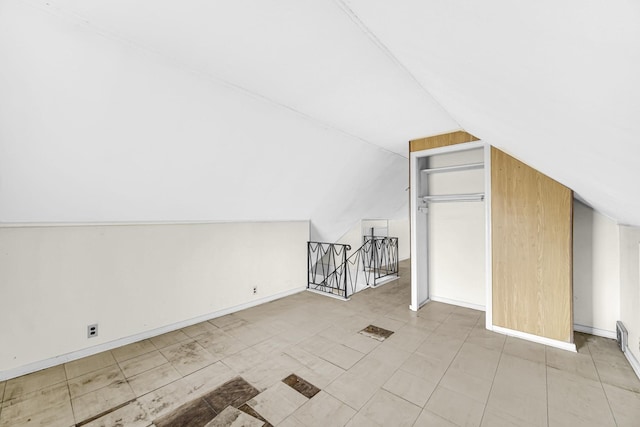 bonus room featuring lofted ceiling