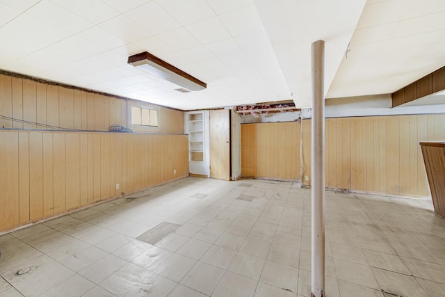 basement with wooden walls